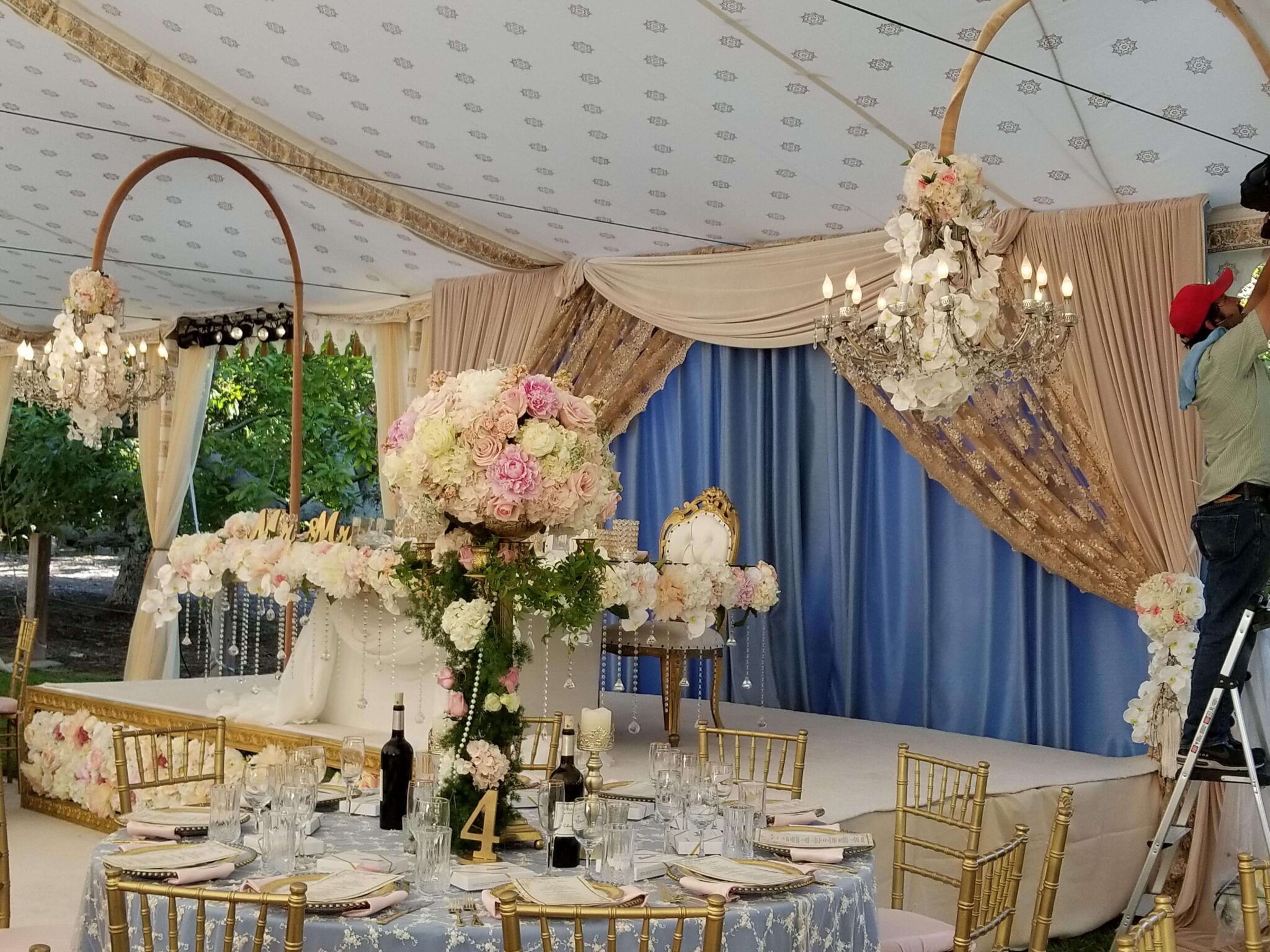 Elegant Victorian tent adorned with antique furniture and velvet drapes, ideal for period dramas or vintage-inspired film scenes